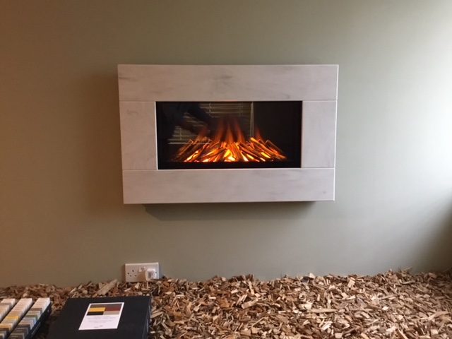Newdawn Electric Fires shown in Witch Hazel, flat wall fix, no recess required simply hang on the wall - On display in our showroom